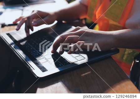 Closeup of team of industrial engineers meeting analyze machinery blueprints consult project on table in manufacturing factory. Working in manufacturing plant or production plant. 129246894