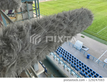 Sound engineer's microphone at a football Sound engineer's microphone at a football 129247083
