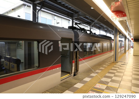 Seibu 10000 Series Red Arrow train stopping at the Ikebukuro Station express platform 129247090