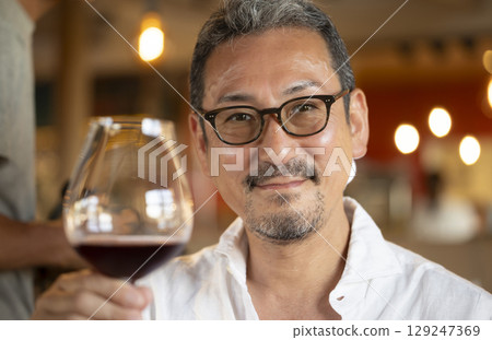 Male drinking wine 129247369