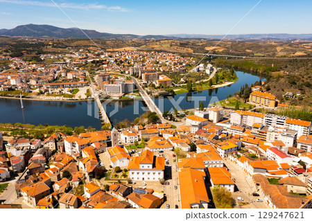 Drone view of Portuguese city of Mirandela on banks of Tua river with fountain 129247621