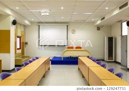 Interior conference room, meeting room, boardroom, Classroom, Office, with white projector board. Interior conference room, meeting room, boardroom, Classroom, Office, with white projector board. 129247731