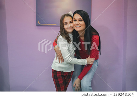 Female teacher with elementary student at language school class 129248104