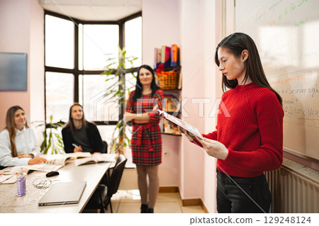 Female student reading at language school 129248124