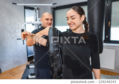 Gym training with electrical muscle stimulation Gym training with electrical muscle stimulation 129248243