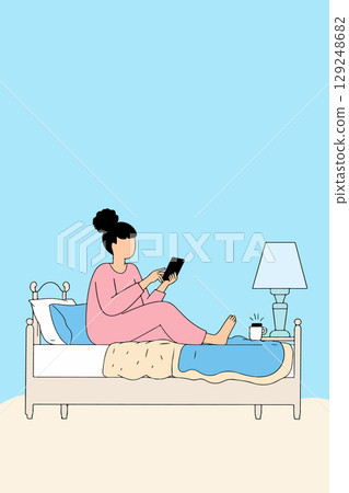 Woman Using Tablet in Bed 129248682