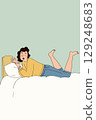 Woman Relaxing on Bed 129248683