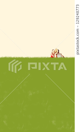 Collage of two women sitting in grass hiding kiss behind straw hat with large copy space Collage of two women sitting in grass hiding kiss behind straw hat with large copy space 129248773