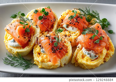 Fitness breakfast. High-protein breakfast in Premium Hotel. Breakfast sushi: scrambled eggs and smoked salmon rolls. Viral food trend. Suitable for menu design. Fitness breakfast. High-protein breakfast in Premium Hotel. Breakfast sushi: scrambled eggs and smoked salmon rolls. Viral food trend. Suitable for menu design. 129248884