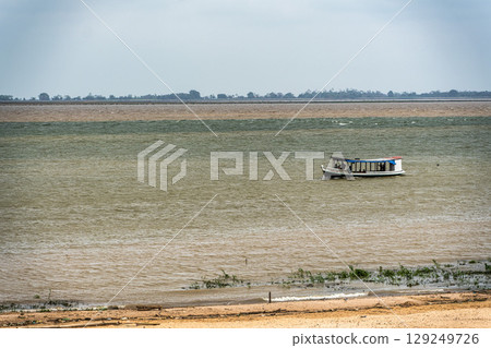 The meeting of the blue waters of the Tapajos River and muddy of the Amazon River in Santarem, Para State, Brazil. The meeting of the blue waters of the Tapajos River and muddy of the Amazon River in Santarem, Para State, Brazil. 129249726