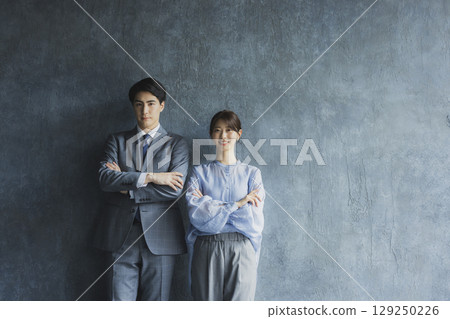 Business person with arms folded 129250226