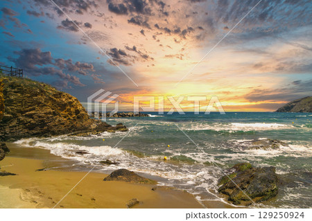 Dynamic coastal landscape showcasing stormy sea and vibrant sunset reflecting climate changes Dynamic coastal landscape showcasing stormy sea and vibrant sunset reflecting climate changes 129250924