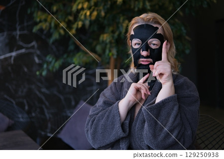 Skincare, woman and face mask in studio with eyes closed for cosmetics, treatment or dermatology on white background. Spa, wellness and model for satisfaction, clear skin or grooming on mockup Skincare, woman and face mask in studio with eyes closed for cosmetics, treatment or dermatology on white background. Spa, wellness and model for satisfaction, clear skin or grooming on mockup 129250938