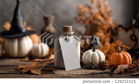 Mockup of white plain label with gift in Halloween theme background. Product advertising template in minimal style with copy space for Text. Warm and rustic color tone. 129251523