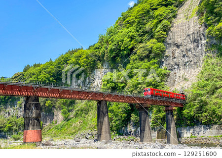 Iwato scenery Hyakueda iron bridge and red train Iwato scenery Hyakueda iron bridge and red train 129251600