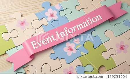 A ribbon with "EVENT INFORMATION" written on it and a cherry blossom jigsaw puzzle. Spring. 129251904