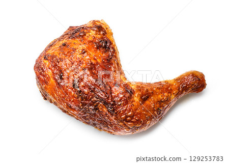 Roasted chicken quarter isolated on white background Roasted chicken quarter isolated on white background 129253783