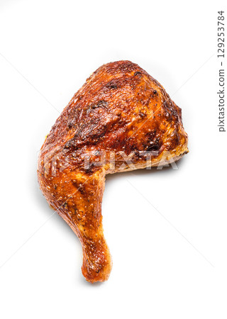 Roasted chicken quarter isolated on white background Roasted chicken quarter isolated on white background 129253784