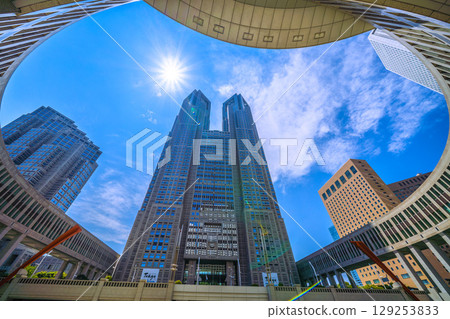 Tokyo cityscape, Japan, August 5th. Overlooking the Tokyo Metropolitan Government Building and office buildings... A ray of hope for a new era... Tokyo cityscape, Japan, August 5th. Overlooking the Tokyo Metropolitan Government Building and office buildings... A ray of hope for a new era... 129253833