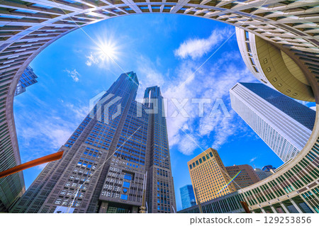 Tokyo cityscape, Japan, August 5th. Extremely hot... View of Tokyo Metropolitan Government Building and office buildings... A ray of hope for a new era... 129253856
