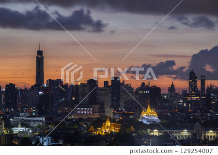 Golden mountain in Wat Saket Ratcha Wora Maha Wihan and Lohaprasat in Wat Ratchanatdaram Worawihan which is landmark in Bangkok, Thailand with bangkok cityscape background. 129254007