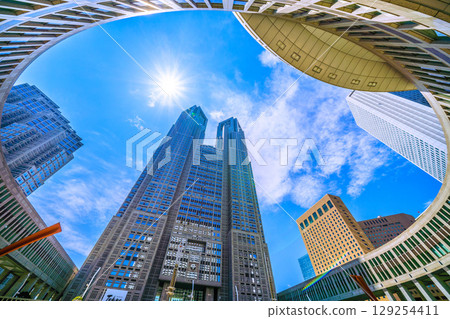 Tokyo cityscape, Japan, August 5th. Extremely hot... View of Tokyo Metropolitan Government Building and office buildings... A ray of hope for a new era... 129254411