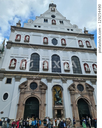 Munich, Germany - July 27, 2025: Facaed of St. Michael's, Jesuit church in Munich, capital city of Bavaria. It is the largest Renaissance church north of the Alps, early Baroque architecture 129254490