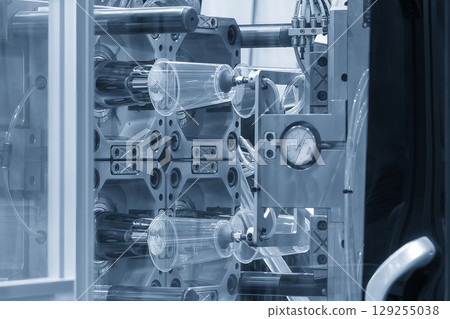 The plastic drinking glass mass production process by plastic injection mold machine in the blue tone. 129255038