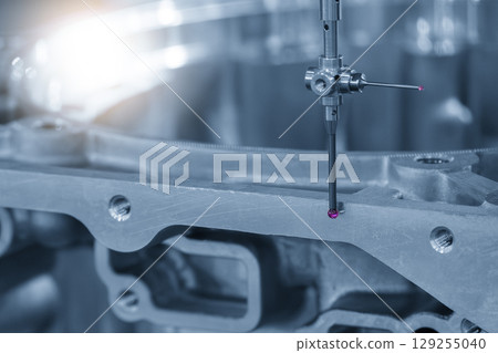 The CMM machine measuring the automotive parts by modular probe in the blue tone. 129255040