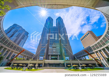 Tokyo cityscape, Japan, August 5th. Extremely hot... View of Tokyo Metropolitan Government Building and office buildings... A ray of hope for a new era... 129255089