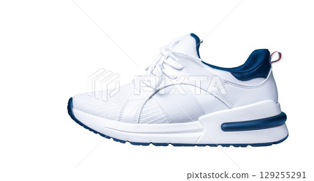 Sneakers isolated on white background. Modern sports urban casual shoe cutout, side view 129255291