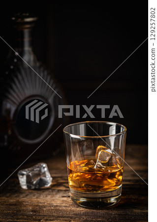 Whiskey with ice in glasses 129257802