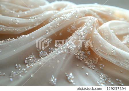 Luxury fabric. Bridal tulle fabric with crystal embellishments on a white background. Luxury fabric. Bridal tulle fabric with crystal embellishments on a white background. 129257894