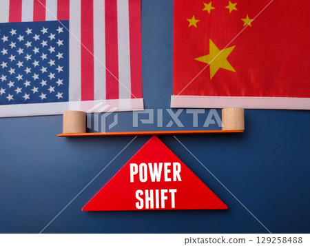 Us and china flag with the word POWER SHIFT on a blue background. Geopolitical concept. Us and china flag with the word POWER SHIFT on a blue background. Geopolitical concept. 129258488