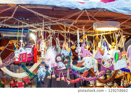 Christmas kiosk with wooden handmade toys on market, angels and nutcrackers 129258662