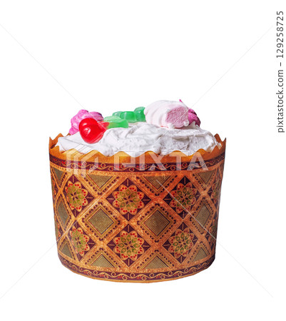 Homemade Kulich isolated on white background. Baked Easter cake decorated white icing, marshmallows, candy Homemade Kulich isolated on white background. Baked Easter cake decorated white icing, marshmallows, candy 129258725