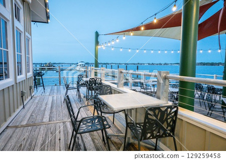 restaurant and seating on the waterfront on cloudy day 129259458