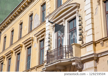 Historic baroque building facade with ornate balcony details. Nagykanizsa, Hungary. 129259504