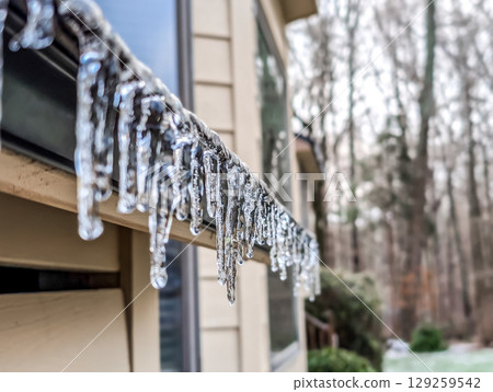 Icicles, a roof, night, darkness, crystal, fragility, a transparency 129259542