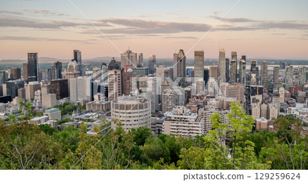 Montreal city skyline panorama at sunset viewed from Mont Royal with urban skyscrapers. Montreal city skyline panorama at sunset viewed from Mont Royal with urban skyscrapers. 129259624