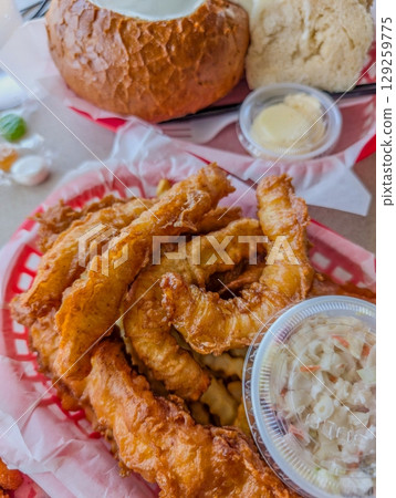 A delicious crispy battered deep fried fish and chips 129259775