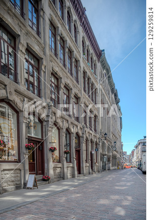 Montreal, Canada - June 05, 2025: skyline and streets of Old Montreal (Vieux) on a sunny day. Montreal, Canada - June 05, 2025: skyline and streets of Old Montreal (Vieux) on a sunny day. 129259814