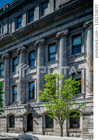 Montreal, Canada - June 05, 2025: skyline and streets of Old Montreal (Vieux) on a sunny day. 129259833
