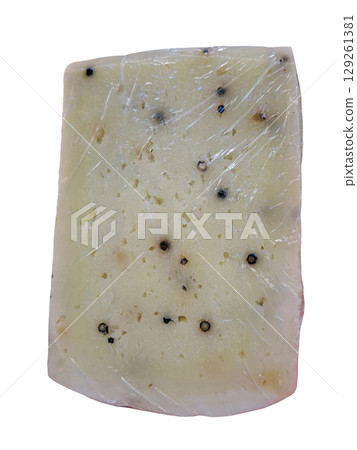A piece of creamy goat cheese is infused with a blend of spices, highlighting its artisan roots. This unique cheese offers rich flavors and a rustic appeal, perfect for culinary enthusiasts. A piece of creamy goat cheese is infused with a blend of spices, highlighting its artisan roots. This unique cheese offers rich flavors and a rustic appeal, perfect for culinary enthusiasts. 129261381
