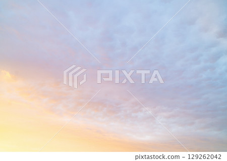 Beautiful twilight sky with soft clouds and pastel colors over the horizon during sunset Beautiful twilight sky with soft clouds and pastel colors over the horizon during sunset 129262042