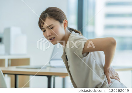 Woman suffering from back pain Generative AI 129262049