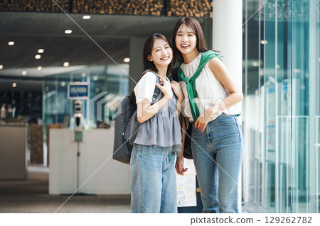 Young woman going shopping with friends Young woman going shopping with friends 129262782