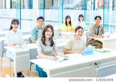 University students studying in a large classroom University students studying in a large classroom 129262909