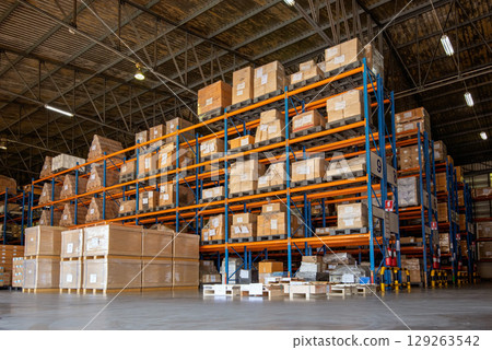 Distribution warehouse shelves filled with products Distribution warehouse shelves filled with products 129263542