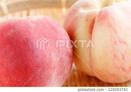 Peaches in a colander, close-up Peaches in a colander, close-up 129263781